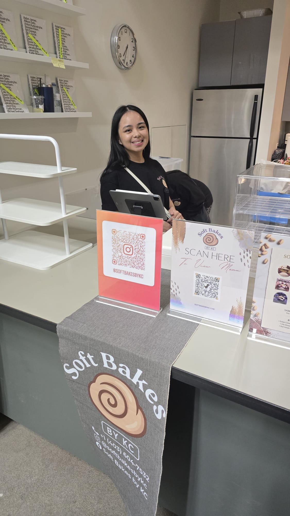 KC, owner of Soft Bakes by KC, at a Calgary community pop-up bakery event